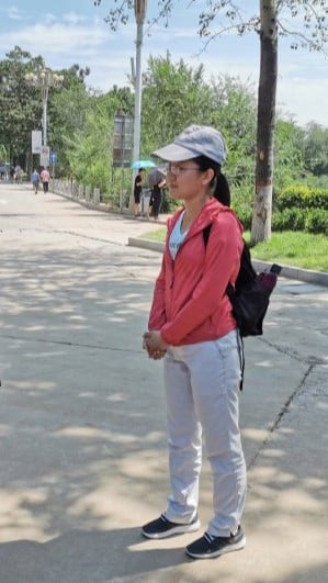 Tianqi standing at a summer school