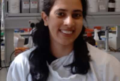 Tanya Singh in front of science bottles