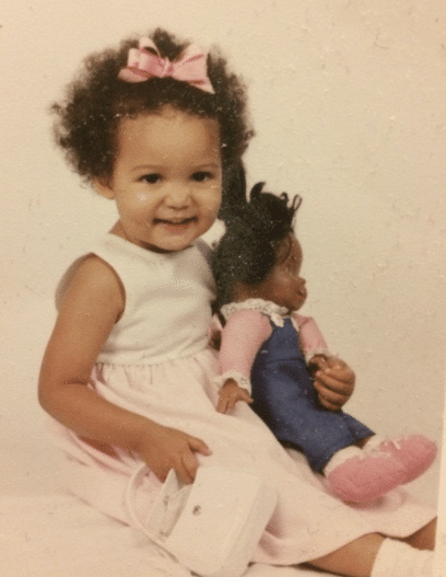 Sam as a baby with her favourite doll