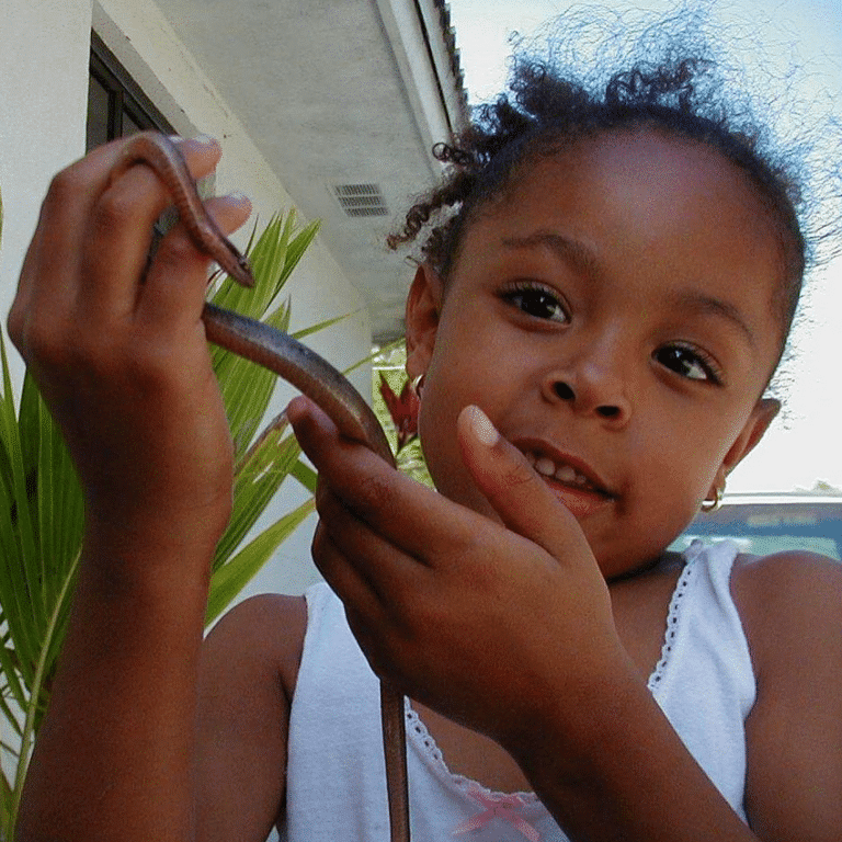 Zoe, aged 5, holding a small snake