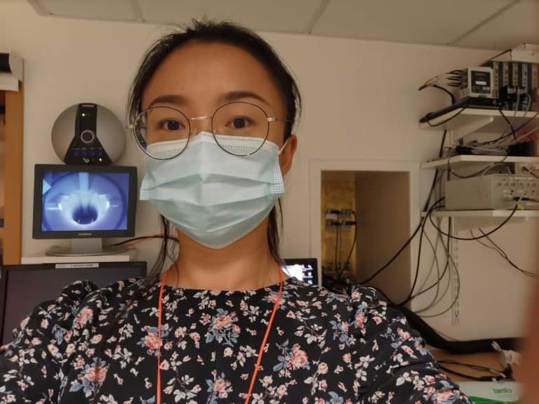 Lin wearing a face mask in the fMRI room at a hospital